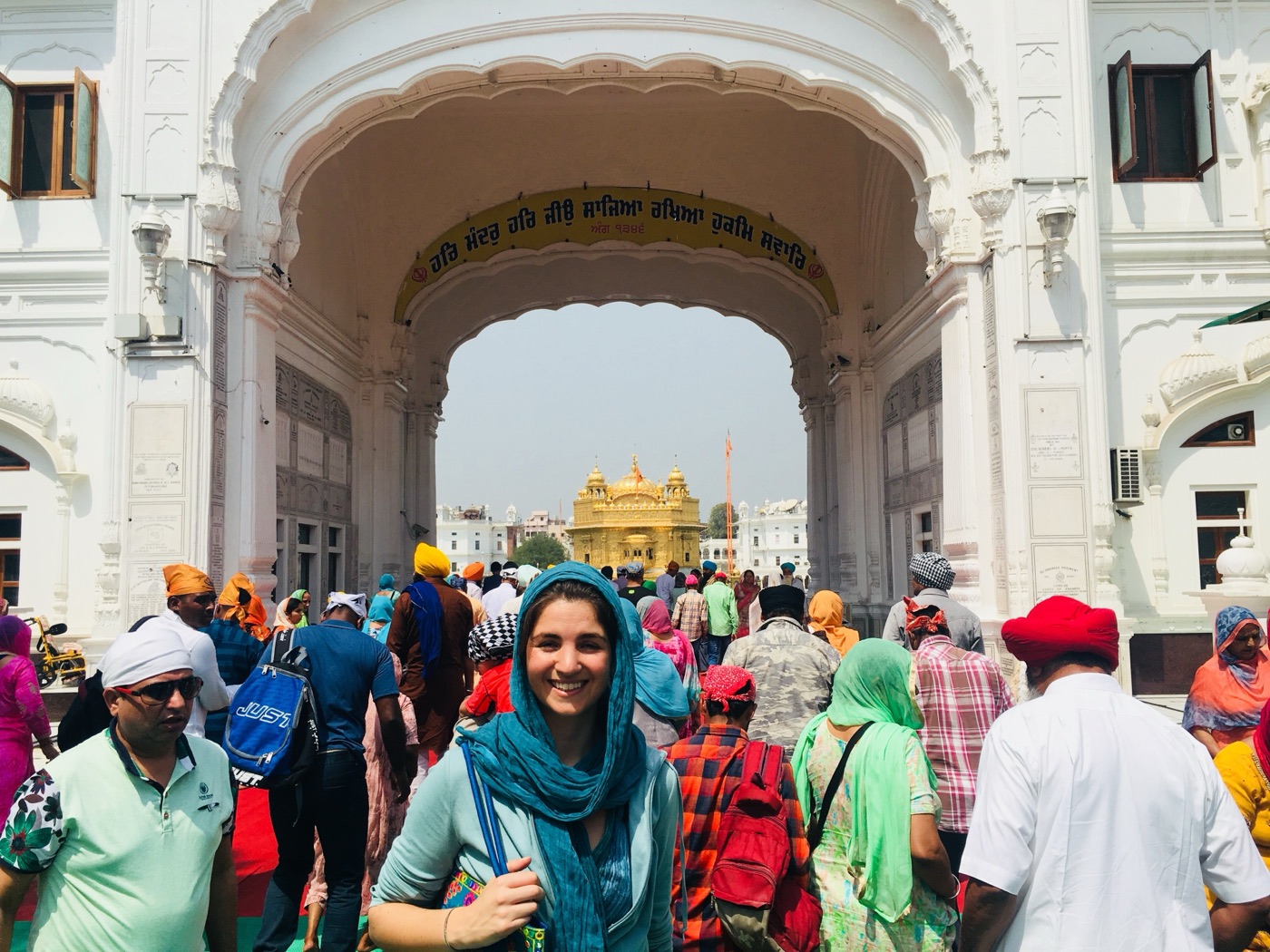Paula Mariani in the field, walking among crowds at the Golden Temple in Amritsar, India